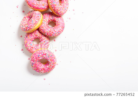 Left pink yummy donuts border. Top view.  77265452