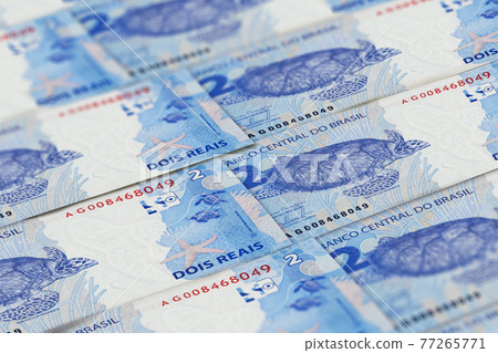 BRL. Closeup Brazilian real banknotes background BRL. Closeup Brazilian real banknotes background 77265771