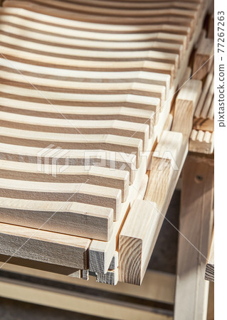 Dishes drying rack made of solid ash timber in the sunlight Dishes drying rack made of solid ash timber in the sunlight 77267263