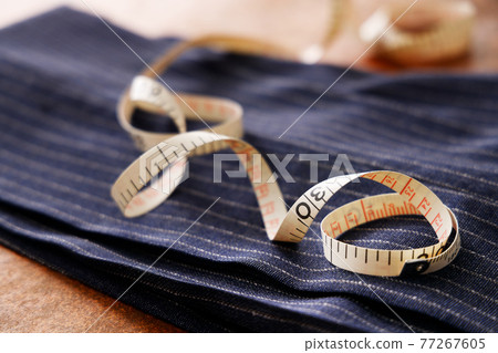 Men's clothing fabric and tape measure tailor image 77267605