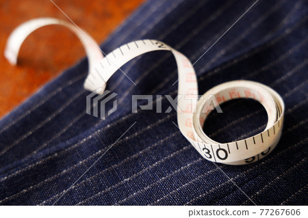 Men's clothing fabric and tape measure tailor image Men's clothing fabric and tape measure tailor image 77267606