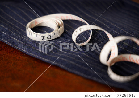 Men's clothing fabric and tape measure tailor image Men's clothing fabric and tape measure tailor image 77267613