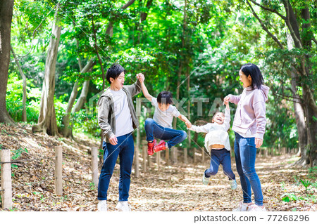 Happy family enjoying a hike in the mountains Happy family enjoying a hike in the mountains 77268296