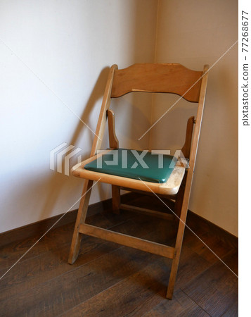 Wooden chair on the windowsill Wooden chair on the windowsill 77268677