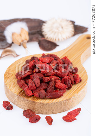 dried cysil, without bones, on a wooden board, on a white background 77268872