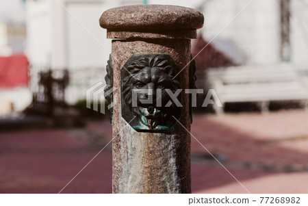 antique european fountain on the streets. 77268982