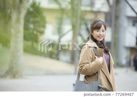 Woman in coat Woman in coat 77269487