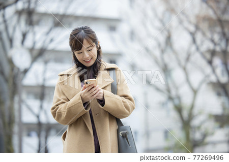 Woman in coat Woman in coat 77269496