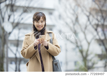 Woman in coat Woman in coat 77269497