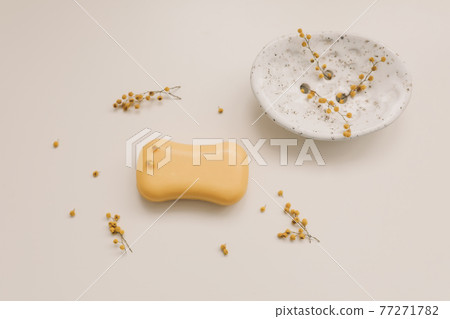 Handmade natural soap on white floral background. Soap making. Soap bars. Spa, skin care. Natural Organic spa cosmetic products on white table from above 77271782