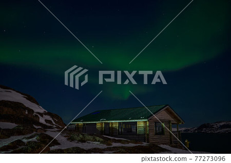 northern light on the silent field before sun rise. northern light on the silent field before sun rise. 77273096