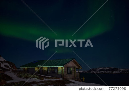 northern light on the silent field before sun rise. northern light on the silent field before sun rise. 77273098