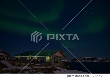 northern light on the silent field before sun rise. northern light on the silent field before sun rise. 77273100