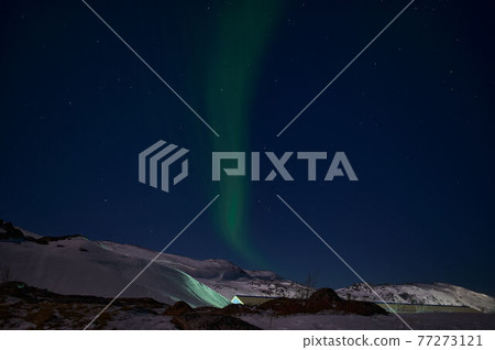 northern light on the silent field before sun rise. northern light on the silent field before sun rise. 77273121