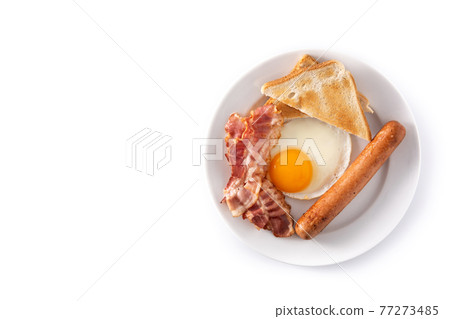 Traditional American breakfast with fried egg,toast,bacon and sausage 77273485