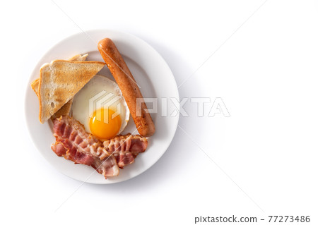 Traditional American breakfast with fried egg,toast,bacon and sausage Traditional American breakfast with fried egg,toast,bacon and sausage 77273486