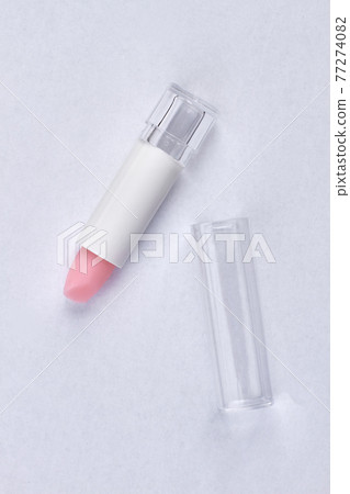 Top view of pink lipstick isolated on white background. Top view of pink lipstick isolated on white background. 77274082
