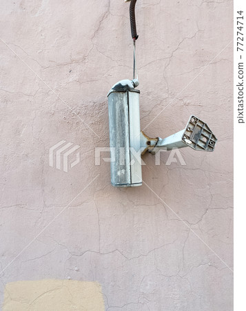 The surveillance camera came off and hangs on wire The surveillance camera came off and hangs on wire 77274714