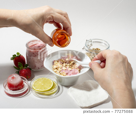 Woman hands making homemade cosmetics. 77275088