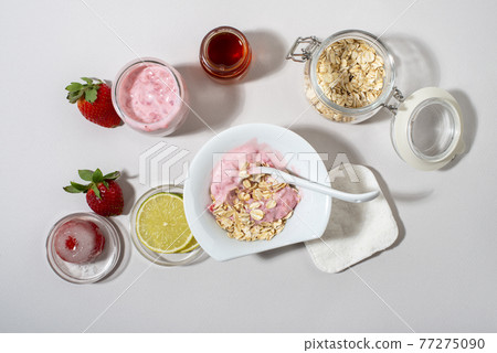 Homemade strawberry face mask ingredients: strawberry, yoghurt, honey, lemon, oatmeal. Homemade strawberry face mask ingredients: strawberry, yoghurt, honey, lemon, oatmeal. 77275090
