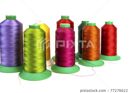 Colorful sewing thread, background, tailor-related images. On a white background. Isolated. Colorful sewing thread, background, tailor-related images. On a white background. Isolated. 77276622