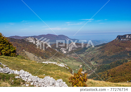 French countryside. Pas de l'Aubasse: View of the heights of the Vercors, the marly hills and the valley Val de Drome 77276734