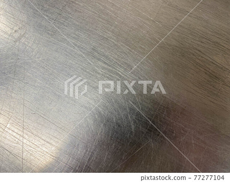 Texture of a shiny chrome-plated metal iron surface with minor scratches and abrasions. The background. Texture Texture of a shiny chrome-plated metal iron surface with minor scratches and abrasions. The background. Texture 77277104