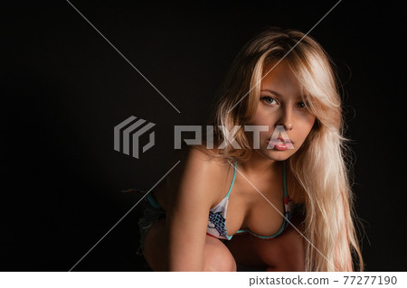 Fitness with a barbell girl blonde athlete on a black background smiles gym sport girl lifestyle strong muscular slim, active dark. Sexy adult sweat, person sportswear 77277190