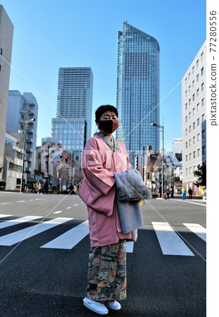 Woman in kimono wearing a mask Woman in kimono wearing a mask 77280556
