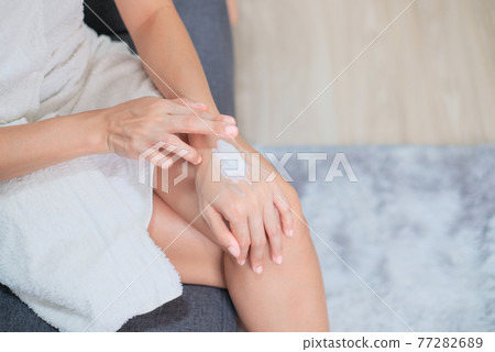 Woman applying natural cream, Woman moisturizing her hand with cosmetic cream, Spa and Manicure concept. 77282689