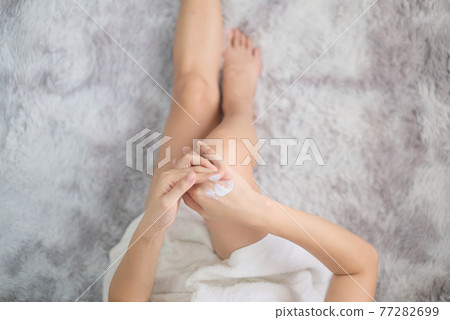 Woman applying natural cream, Woman moisturizing her hand with cosmetic cream, Spa and Manicure concept. 77282699