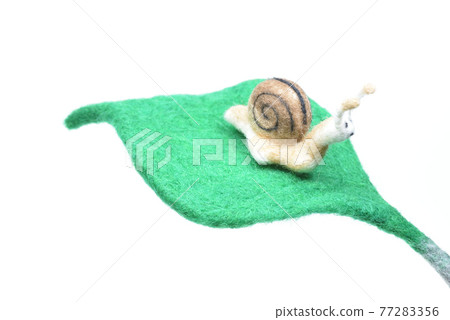 Snails and green leaves made from needle felt Snails and green leaves made from needle felt 77283356