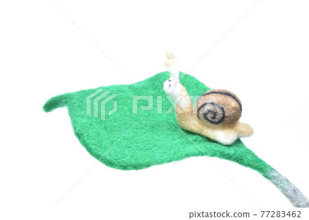 Snails and green leaves made from needle felt Snails and green leaves made from needle felt 77283462