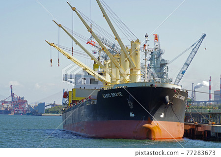 View of cargo ship loading and unloading at grain pier 77283673