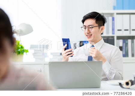 man read news with smartphone man read news with smartphone 77286420