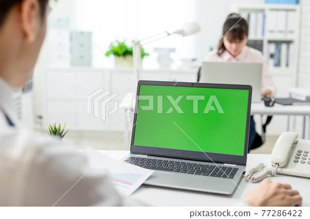man with green screen laptop man with green screen laptop 77286422