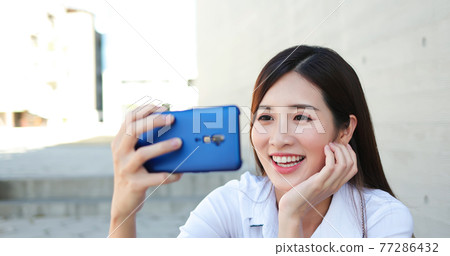 Asiian businesswoman has video chat Asiian businesswoman has video chat 77286432