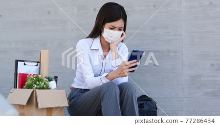 Asian woman being fired 77286434