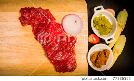 top view Fresh meat on a cutting board. top view Fresh meat on a cutting board. 77286595