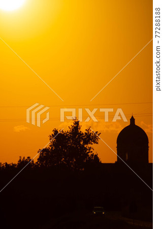 Sunset in summer with silhouette of church dome, Italy Sunset in summer with silhouette of church dome, Italy 77288188