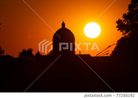 Sunset in summer with silhouette of church dome, Italy 77288192