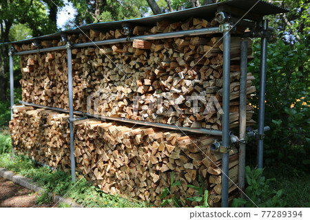 Firewood piled up on the roof 77289394