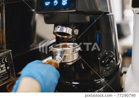 Ground coffee in a holder for making coffee 77290790