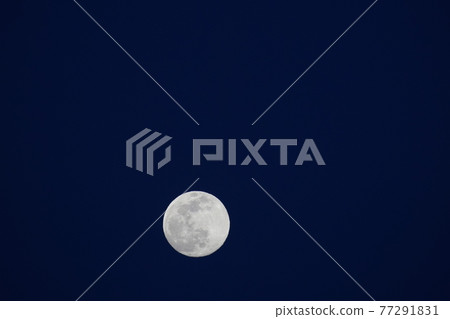 A full moon that shines brightly in the sky A full moon that shines brightly in the sky 77291831