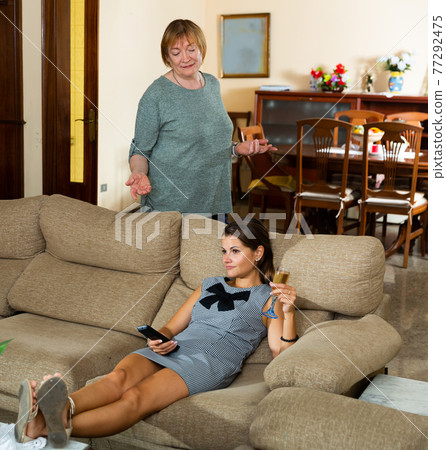 Elderly mother and adult daughter scandal in domestic interior Elderly mother and adult daughter scandal in domestic interior 77292475