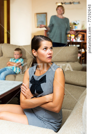 Frustrated woman with disgruntled elderly mother and upset preteen son Frustrated woman with disgruntled elderly mother and upset preteen son 77292648