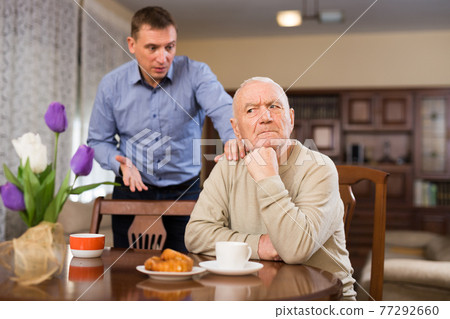 Man and his adult son having conflict 77292660