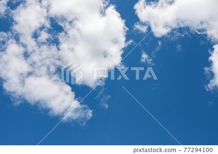 bright blue sky half covered by white clouds. Pure, clear cumulus cloud in sky on sunny day. Earth atmosphere. 77294100