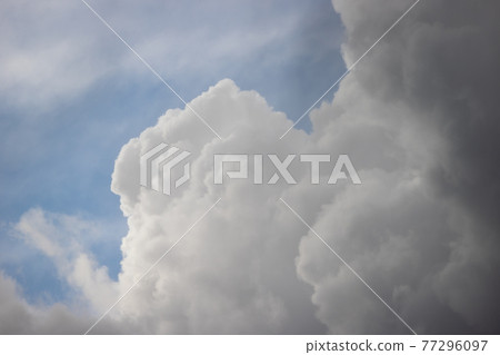 Cumulonimbus clouds in the early summer sky Cumulonimbus clouds in the early summer sky 77296097