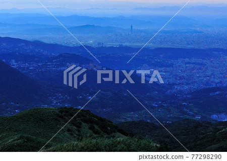 Early morning mountain and cityscape in blue tones 77298290